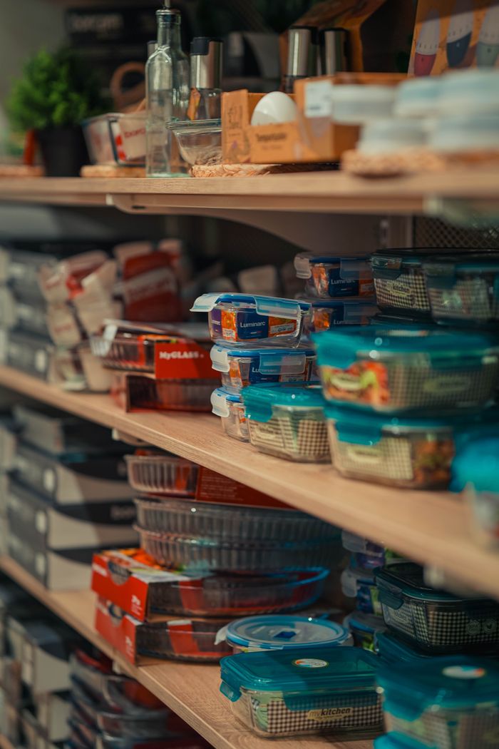 creative-03 Neatly arranged storage containers on pantry shelves showcasing home organization.